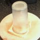 Cutting circle from toast with large drinking glass