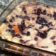 The baked bread pudding is cooled on a rack.