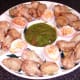 Cooled chicken wings are arranged on serving plate