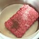 Seasoned beef added to stew pot