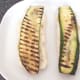 Griddled zucchini slices laid on roll bottoms