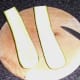 Seeds and innermost flesh are scooped from zucchini halves