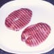Gammon steaks are laid on serving plate