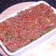 Three layers of spicy beef and two of zucchini slices has been assembled