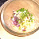 Combining pineapple salsa ingredients