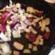 Once the butter is melted, add the onions and garlic to the pan. Allow it to cook for a few minutes.