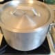 Put the lid on the pan and allow the polenta to cook for approximately 25 minutes, stirring every 5 minutes or so. You will want to switch from the whisk to a spoon at this point.