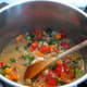 Add the spring onions and parsley to the pot.