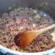 Browning the minced meat.