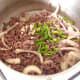 Garlic and chilli added to beef and onion