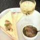 Spooning coriander and lime potted crayfish tails on to buttered bread