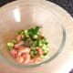 Mixing crayfish tails with cucumber and dill