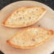 Toasted cheesy bread roll halves