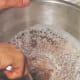 Pour pulverized chocolate into the warmed cream and begin to blend