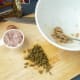 Mash the anchovies, garlic and capers together to form a paste