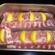 Now, distribute the lemon sections on top of each rack.