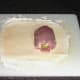 Stuffed chicken thigh is laid on egg washed pastry