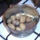 Butter and dill are added to potatoes