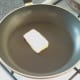 Butter is melted in frying pan