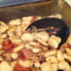 Transfer the mixture into a 8 or 9 inch baking dish. The garlic smeared on the sides will add to the taste.