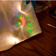 Scrapbook paper. Choose something that's going to match your cake theme.