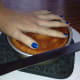 Turn the pan against the knife