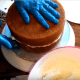 Center the second layer on the first and press down evenly around the cake to secure it in place.
