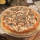 With all the toppings on the pie it is time to put it in the oven.