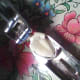 Putting garlic clove into garlic press.