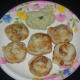Lentil and rice dumplings (gundpongal) with fried gram and coconut chutney