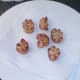 Twice fried potato crowns are drained briefly on kitchen paper