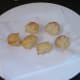 Potato crowns are drained on kitchen paper and left to cool