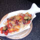 Vegetables and tagliatelle are added to serving plate