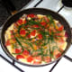 Samphire seaweed is scattered in to pan