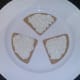 Cream cheese is spread on oatcakes