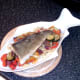Cod fillet is laid on vegetable tagliatelle