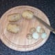 Ends are trimmed from cooled potatoes