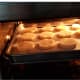 Put the tray of cookies in the toaster oven.