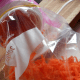 minnesota-cooking-carrots-using-a-salad-shooter-to-grate