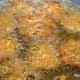 Deep-frying the cabbage fritters