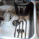 The immersion heater usually has a layer of brown slime that can be wiped off with a paper towel. The basket has a little bit more things embedded in the screen.