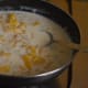 Blending the pineapple and sago dessert together.
