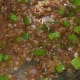 Soy sauce and spring onion added