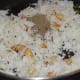 Mixing the Rice with Garlic and Other Spices