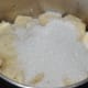 Add the chopped banana and sugar to a mixer. Grind to get a paste.