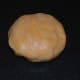 Step five: Pinch out a big lemon-sized ball of dough and form a ball.