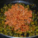 Step seven: Add ground coconut and spice mix.