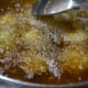 7. Fry the balls till they are golden-brown.