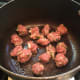 It doesn't take long at all to fry the meatballs, just lightly browning them will do.