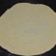 Step four: Take a lemon-sized dough ball and roll it into a thin pancake.
